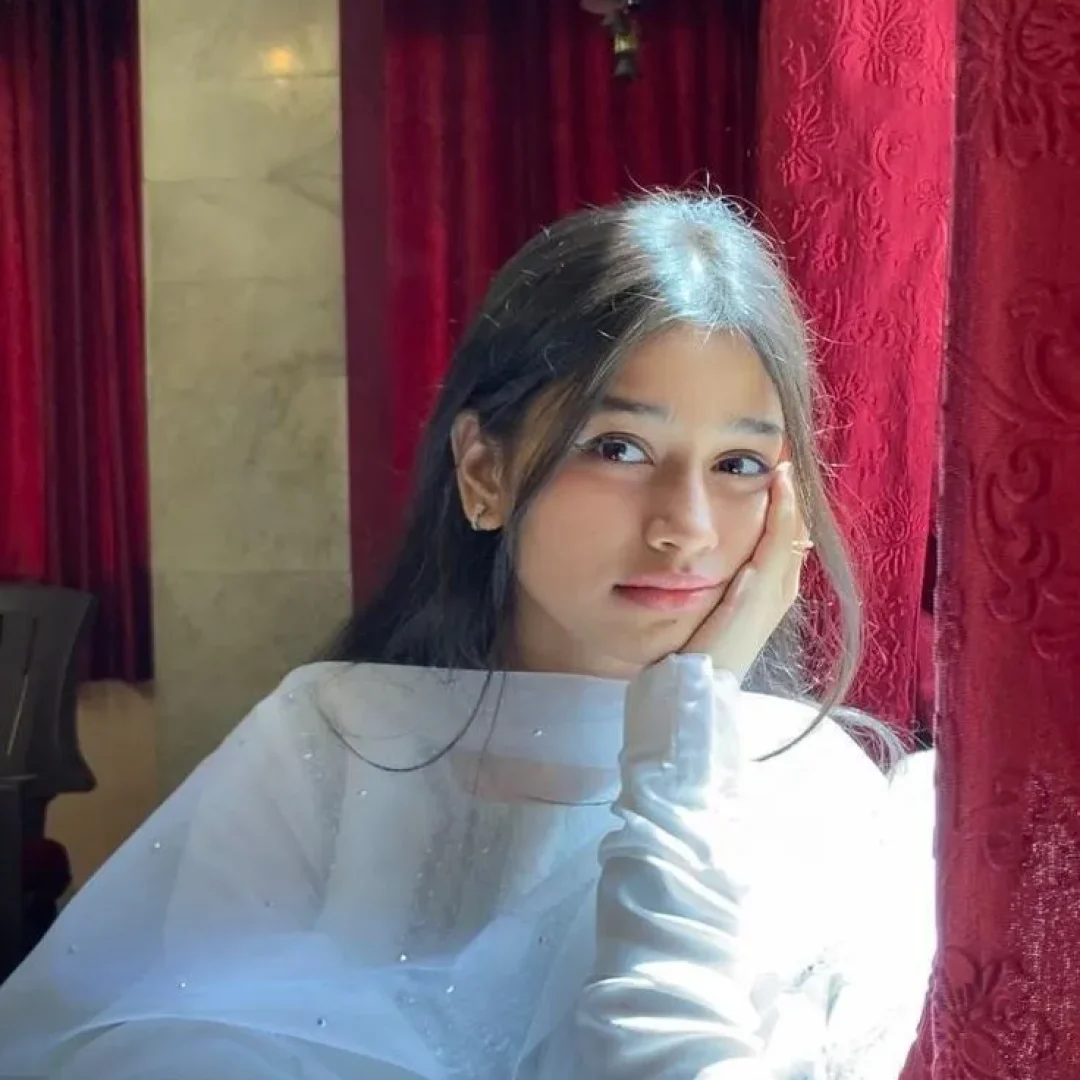 Girl posing with her mobile phone